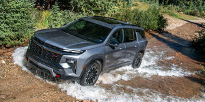 A 2026 Chevy Traverse from Valley Stream, NY traversing through a watery dirt path.
