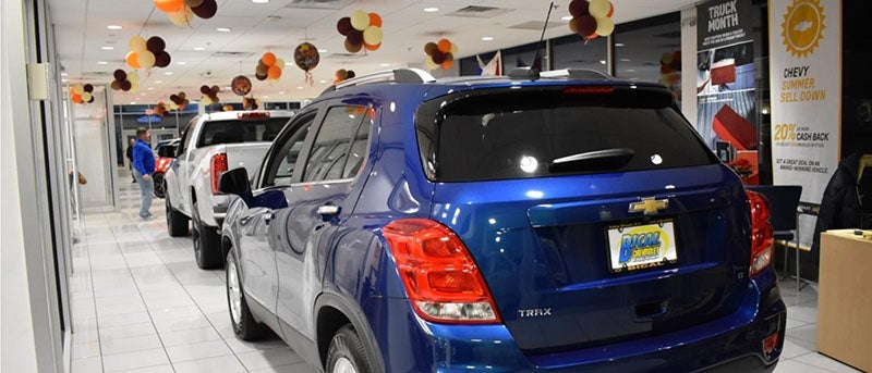 Dealership showroom with multiple vehicles in sight